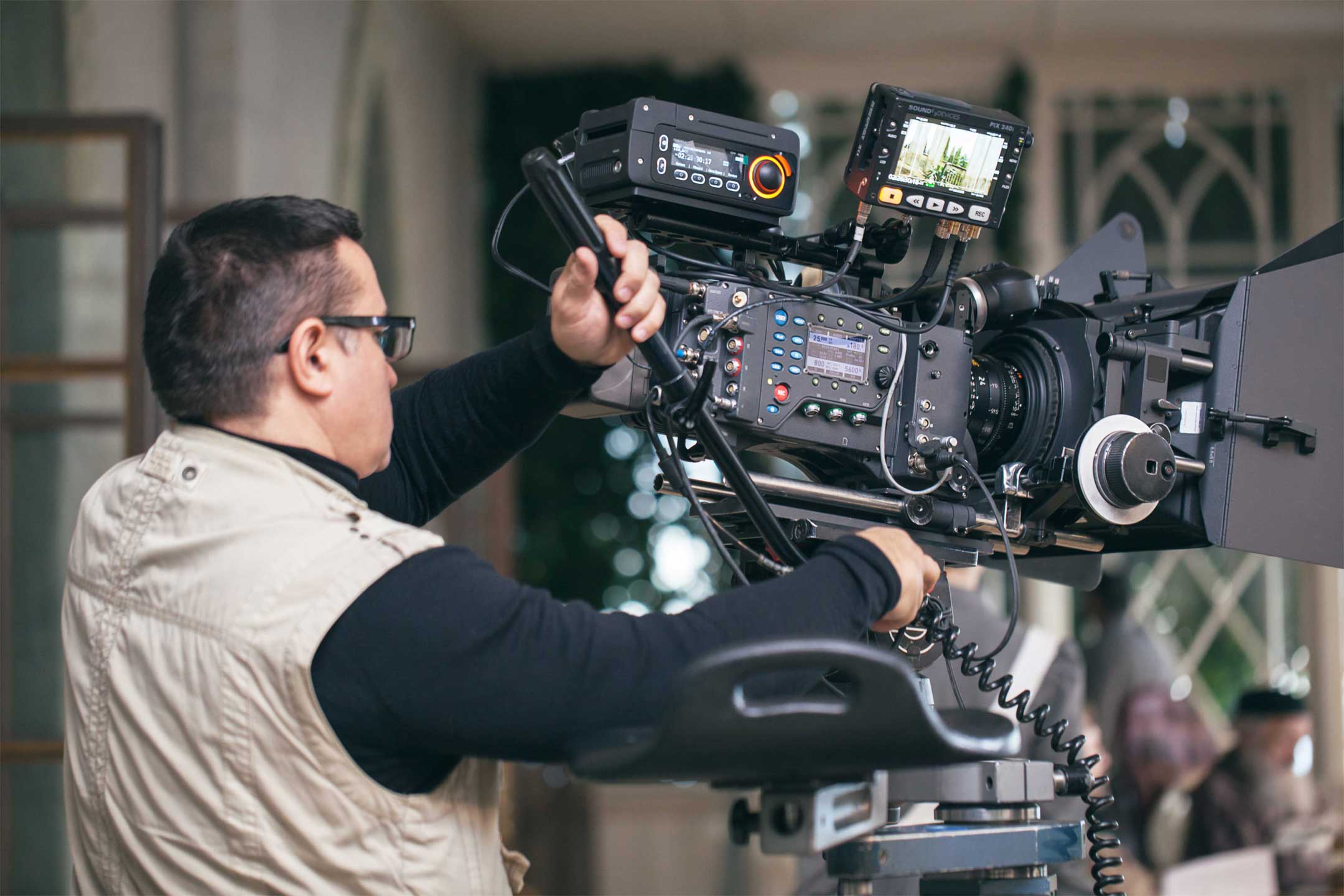 man using a professional video camera